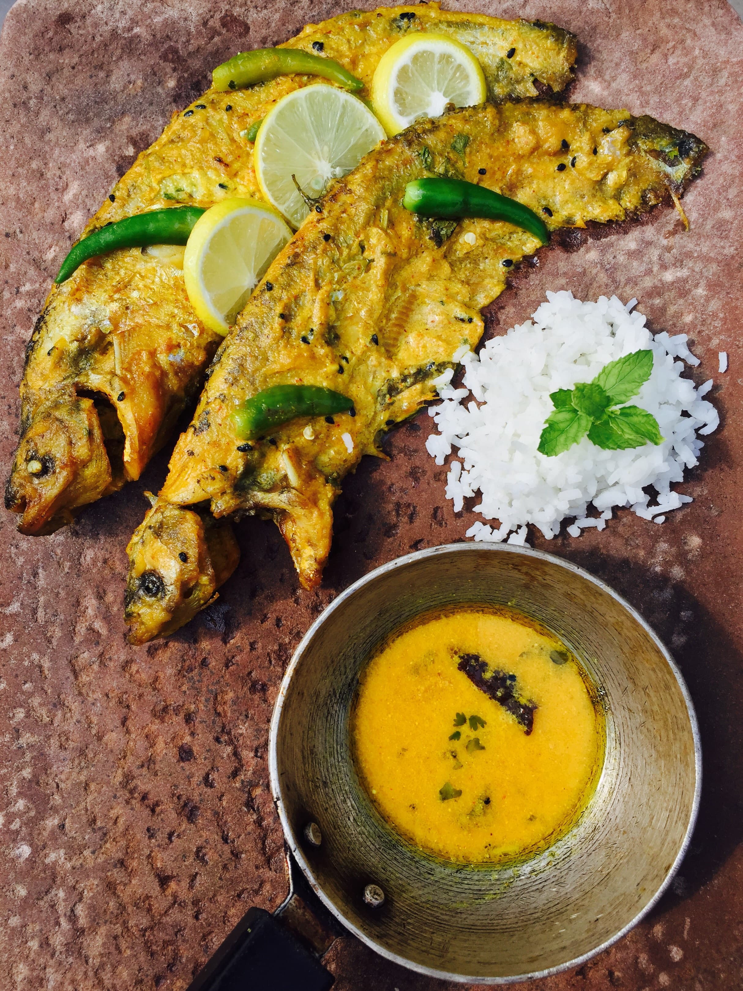 Traditional freshwater fish cooking in mustard oil